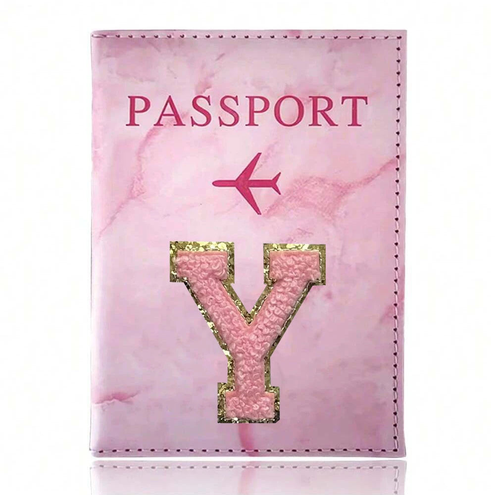 Pink marbled passport cover featuring a gold initial Y