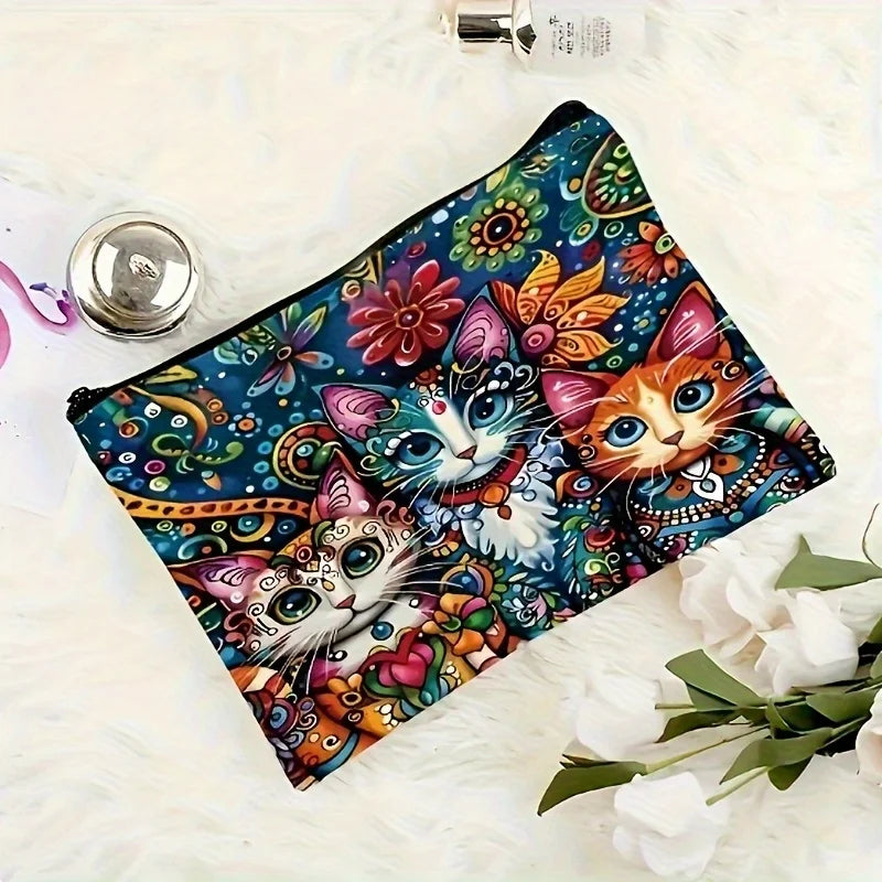 A vibrant, colorful makeup pouch featuring a detailed cat design, set against a white fluffy background.