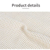 Close-up of a beige reusable cotton mesh produce bag fabric texture.