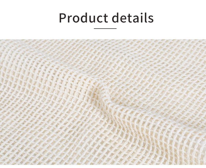 Close-up of a beige reusable cotton mesh produce bag fabric texture.
