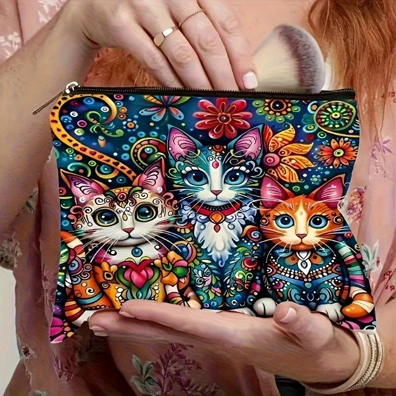 A colorful bohemian day of the dead travel makeup pouch featuring detailed cat illustrations.
