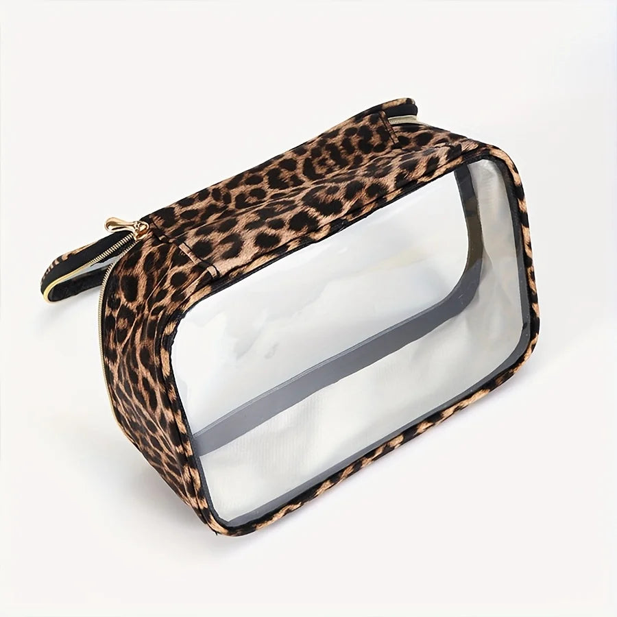 A leopard print clear cosmetic bag with a gold zipper, shown from above.