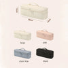 A collection of durable travel hair dryer storage bags in beige, pink, slate blue, and black.