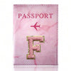 Pink marbled passport cover featuring a gold initial F and a pink border.