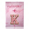 Pink marbled passport cover featuring a gold embroidered letter K