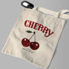 A beige canvas shoulder tote bag featuring a red cherry print with the text Have a Nice Day.