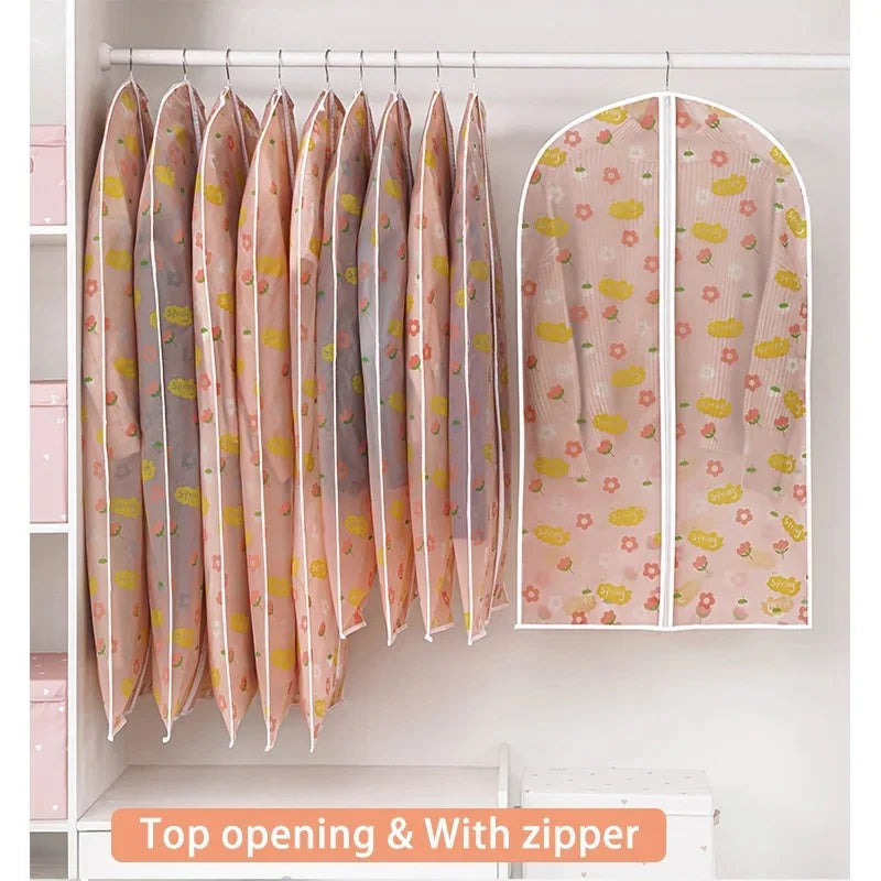 Clear garment dust covers for hangers displayed on a white shelf.