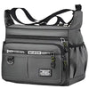 A gray leather men's business crossbody bag with black straps and zippered compartments.