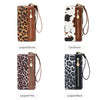 A collection of leopard print clutch wallets in brown and black patterns with gold hardware.