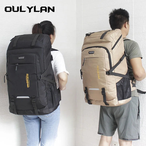 A person is shown carrying a large capacity travel backpack with a rain cover.