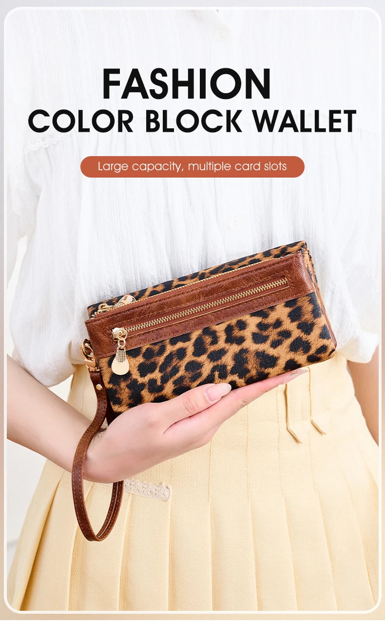 A brown leopard print block wallet is held by a person against a light yellow background.
