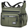 A olive green men's business crossbody bag with black straps and zippers.