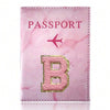 Pink marbled passport cover featuring a gold embroidered letter B
