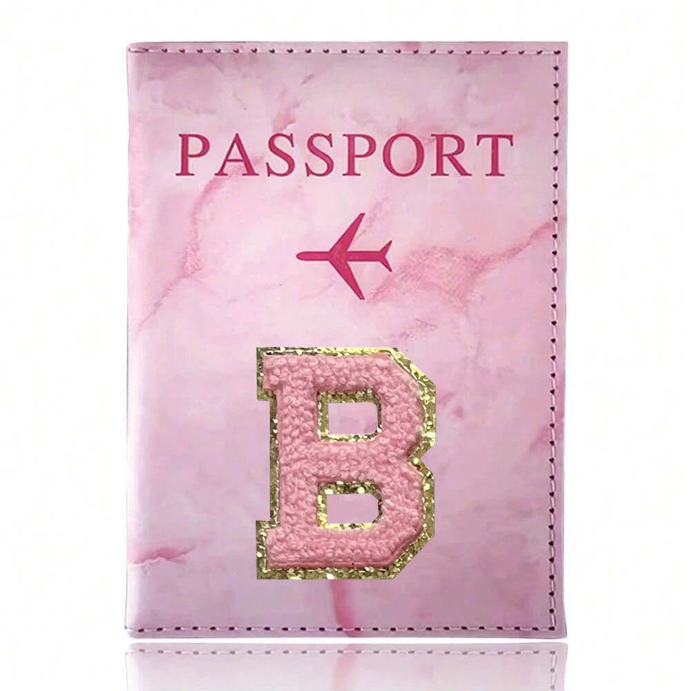 Pink marbled passport cover featuring a gold embroidered letter B