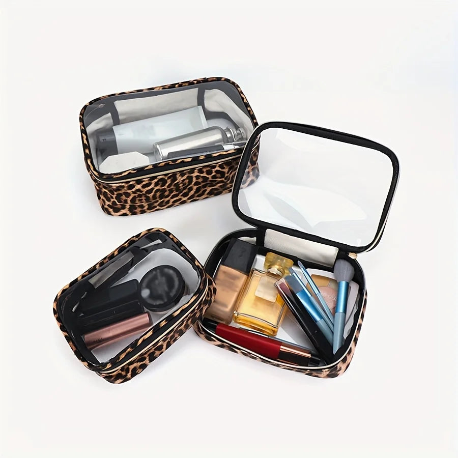 Leopard print clear cosmetic bag with an open lid showing various makeup and beauty products inside
