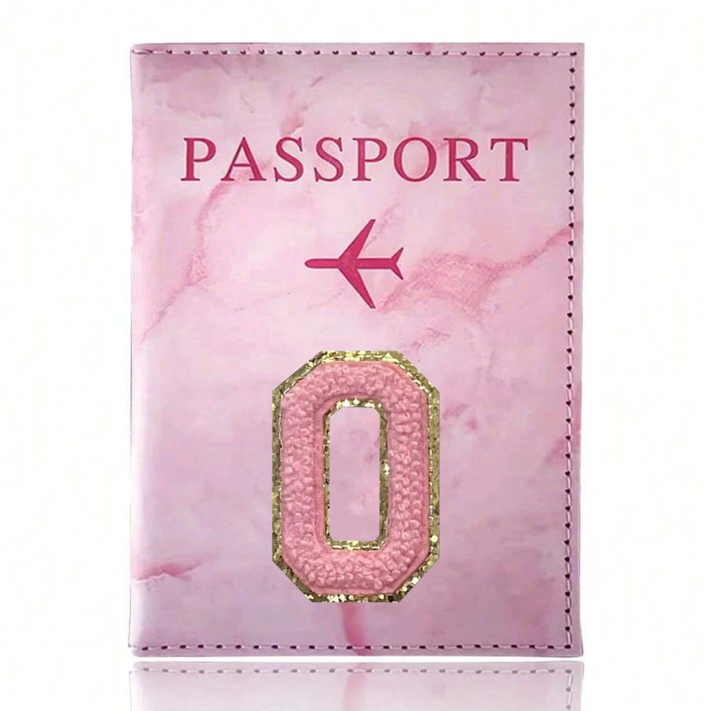 A pink marbled passport cover featuring a gold embossed letter O.