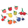 A collection of fruit-shaped coin purse keychains in red, green, and yellow colors.