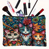 A colorful makeup pouch featuring a cat design with vibrant floral and geometric patterns.