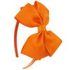 A bright orange satin bow headband is shown against a white background.