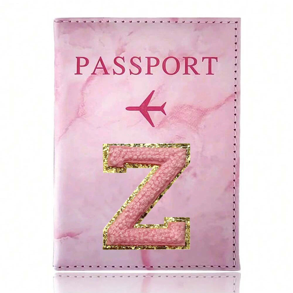Pink marbled passport cover featuring a gold embroidered letter Z