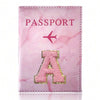 Pink marbled passport cover featuring a pink airplane and a gold embroidered letter A
