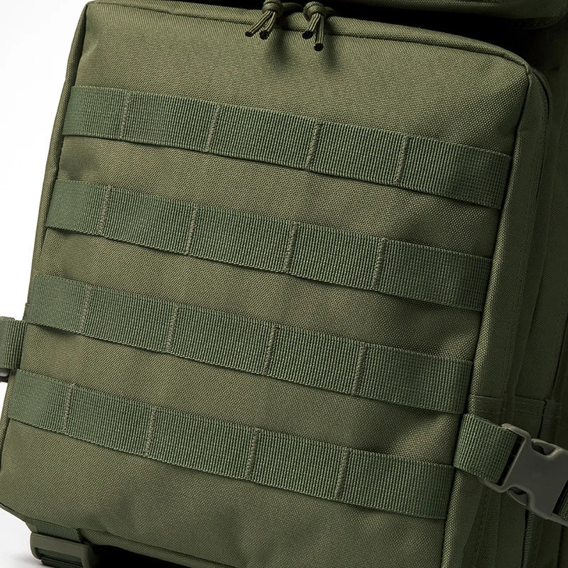 Olive green tactical backpack featuring multiple webbing straps and a top closure.
