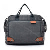 A dark gray canvas crossbody messenger bag with black straps and an orange accent.