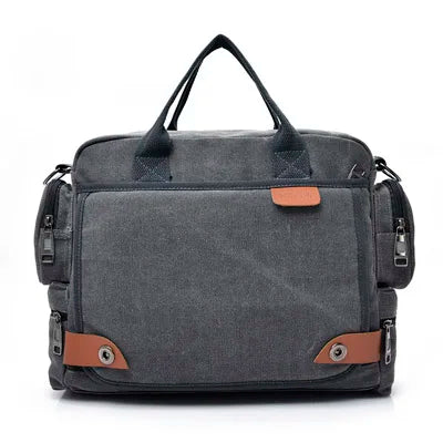 A dark gray canvas crossbody messenger bag with black straps and an orange accent.