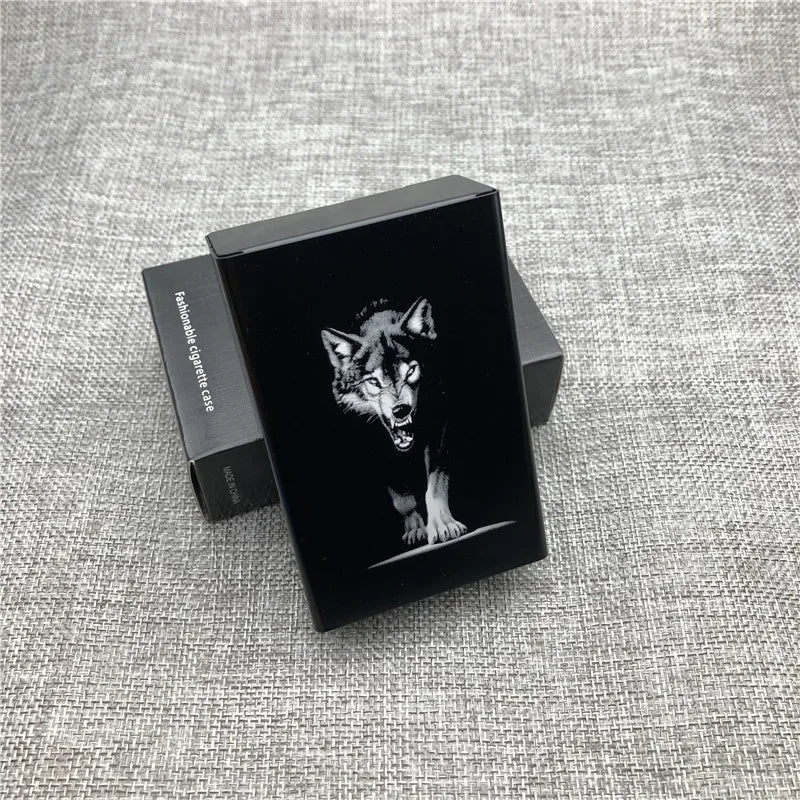 A black custom engraved cigarette case featuring a detailed image of a wolf's face on a gray textured surface.