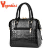 Black crocodile-embossed leather tassel shoulder bag with gold hardware