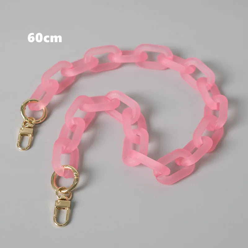 A pink adjustable detachable chain shoulder bag with a 60cm length shown on a gray background.