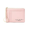 A pink compact PU leather zip wallet with a gold chain keychain.