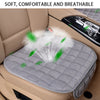 A gray quilted car seat cover is shown placed in a car seat, emphasizing its soft and breathable features.