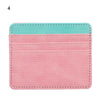 A pink and turquoise PU leather card holder wallet with a stitched edge.