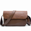 A brown retro PU leather crossbody shoulder bag with a leather strap shown against a white background.