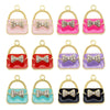 Un ensemble de six charms en alliage émail de cristal aux couleurs et motifs variés.