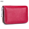 A vibrant red genuine leather accordion card holder wallet with silver zipper details.
