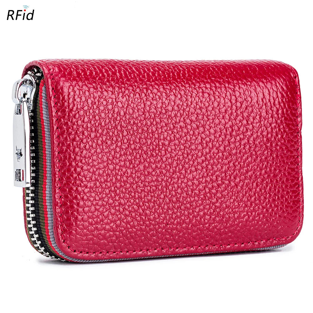 A vibrant red genuine leather accordion card holder wallet with silver zipper details.