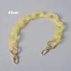 A yellow plastic chain shoulder bag measuring 42cm, shown laid out.