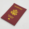 A maroon leather passport holder embossed with the United States of America eagle design and text.
