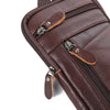 A close-up view of a brown genuine leather crossbody phone pouch belt bag with zippered compartments.