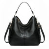 Black vintage faux leather hobo shoulder bag with gold hardware shown from the front.