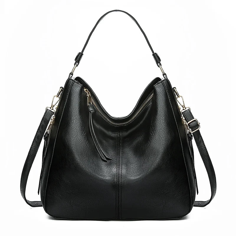 Black vintage faux leather hobo shoulder bag with gold hardware shown from the front.
