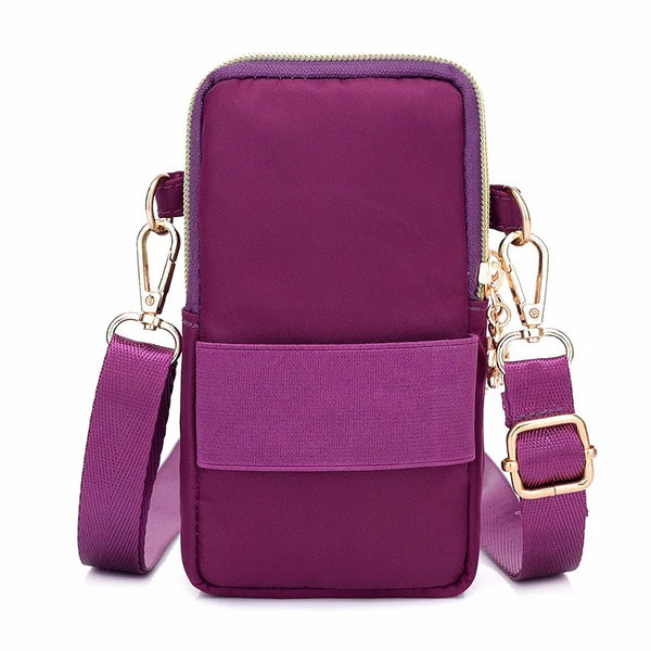 Bolso cruz impermeable de nylon morado intenso con cremallera y correa ajustable.