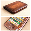 A brown genuine leather RFID blocking wallet is shown open, displaying several cards and cash.
