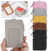 A collection of pink, gray, yellow, and brown PU leather card holder wallets with metal keychains.
