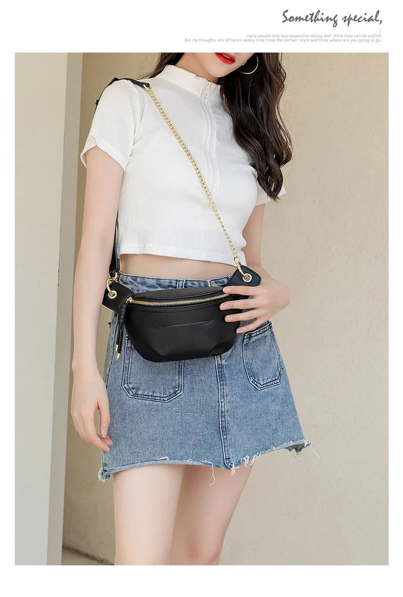 A woman wearing a white cropped top and denim skirt holds a black PU leather crossbody sling bag.