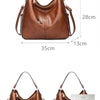 A brown vintage faux leather hobo shoulder bag shown with a white Apple iPhone.