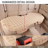 Close-up view of a tan plush car seat cover showing detail design features like covered edges, a reserved safety buckle, and 