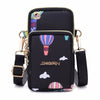 Black waterproof nylon crossbody bag featuring colorful striped accents and gold hardware.